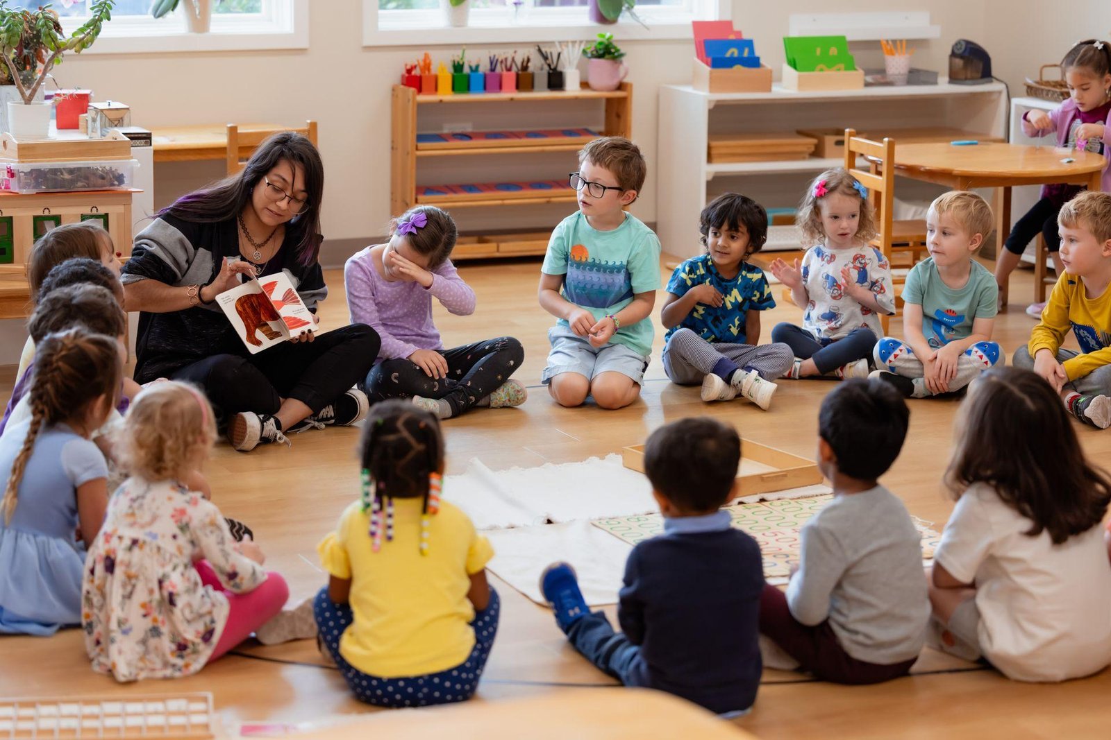 Teacher and children enjoying a group activity